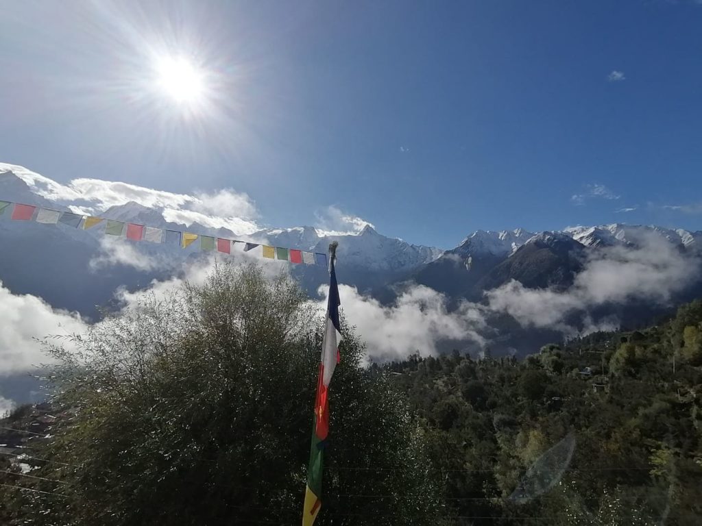 Kinnaur Kailash mountain peaks garlanded with clouds. 