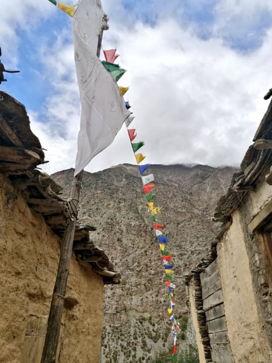 Tibetan prayer flag fluttering in Charang