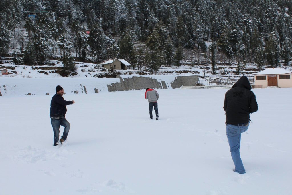 Snowball fighting on Kalpa football ground in Kinnaur