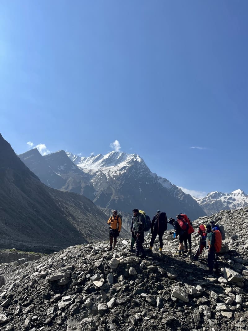 Trekkers gathered at river crossing point before Chowki camp